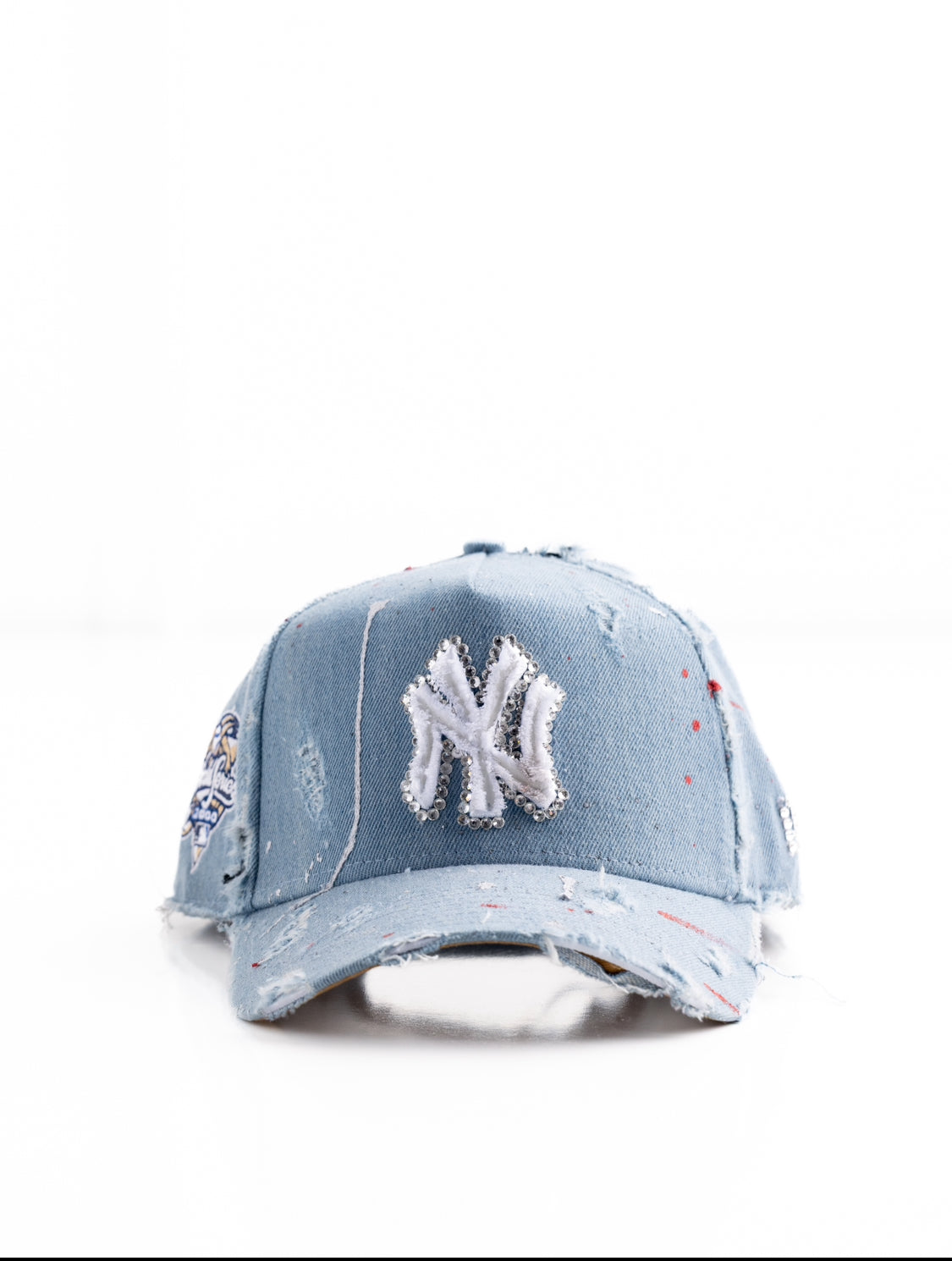 NY Yankees blue denim cap with painted rips and rhinestone designs
