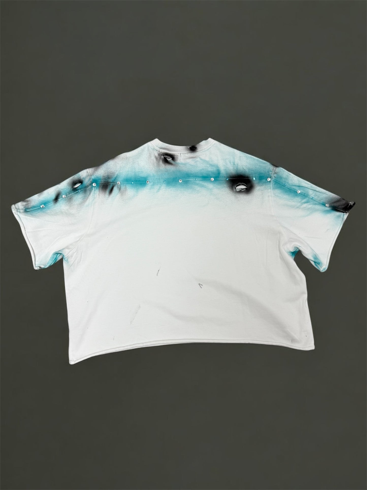 White t-shirt with paint and rhinestone design