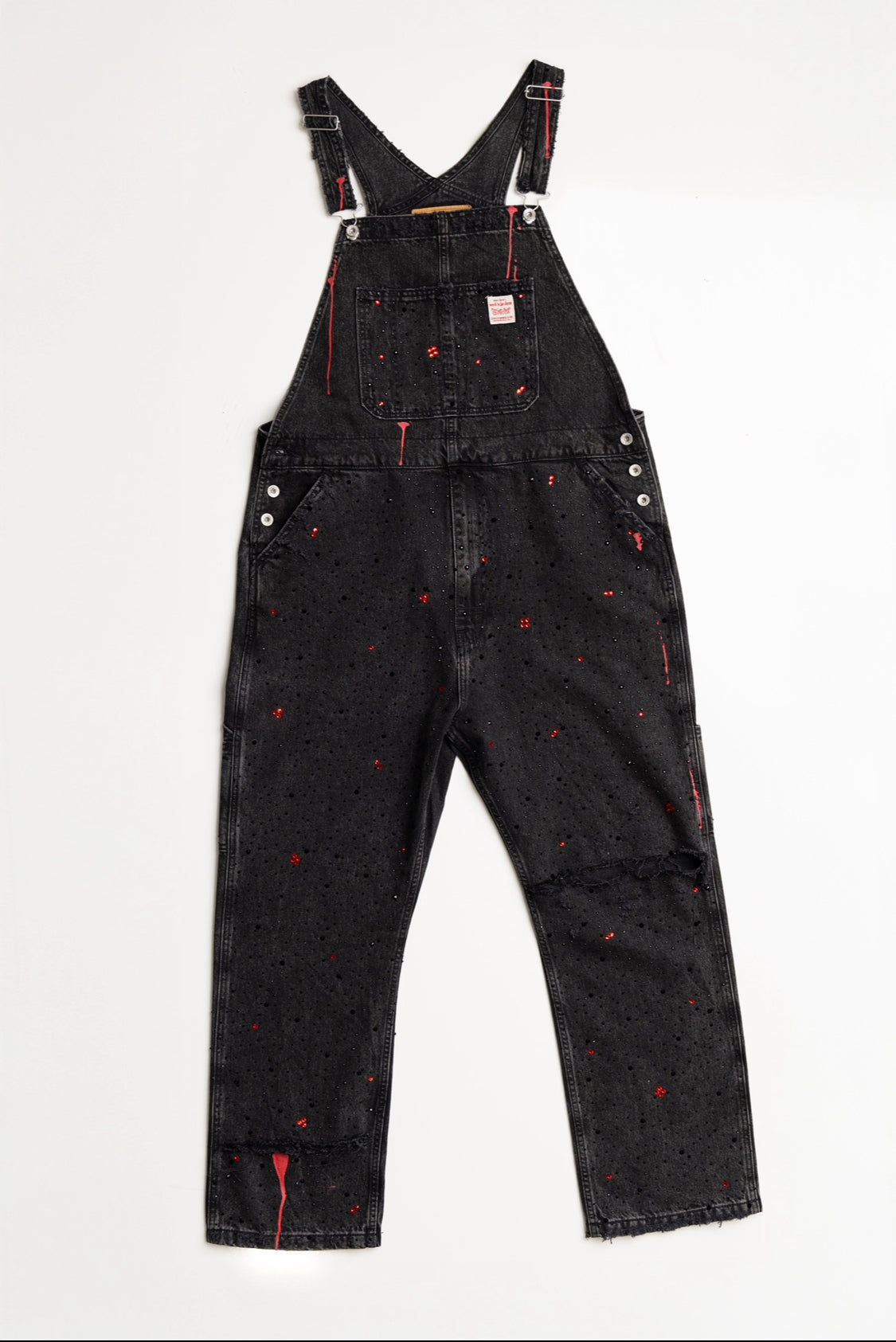 Black denim overalls designed with rhinestones and black and red paint