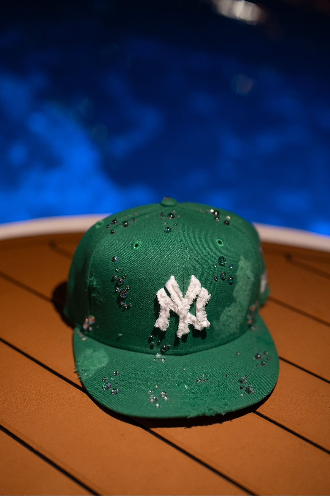 Green NY Yankees New Era cap with a water droplet design