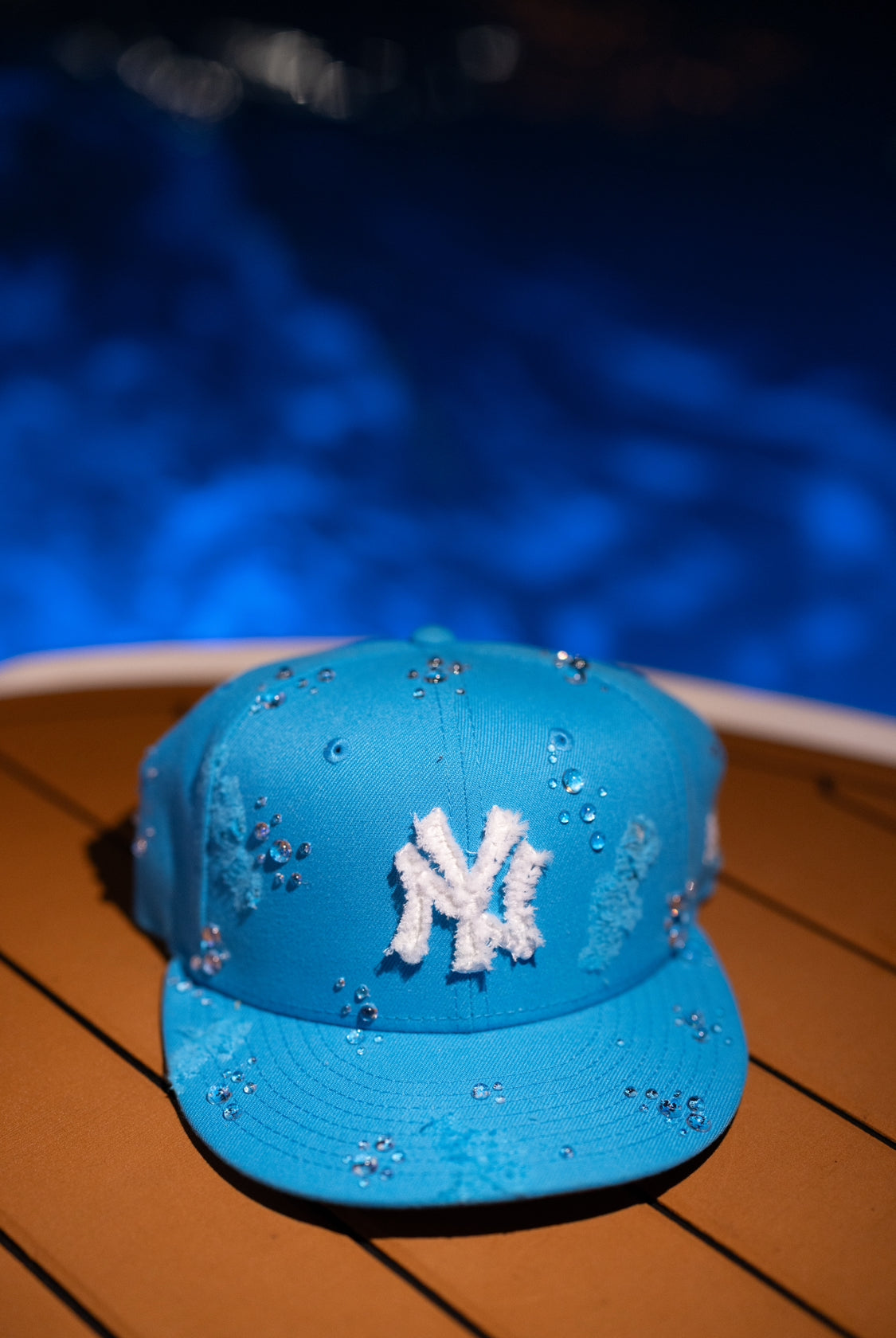 Light blue NY Yankees New Era cap with a water droplet design