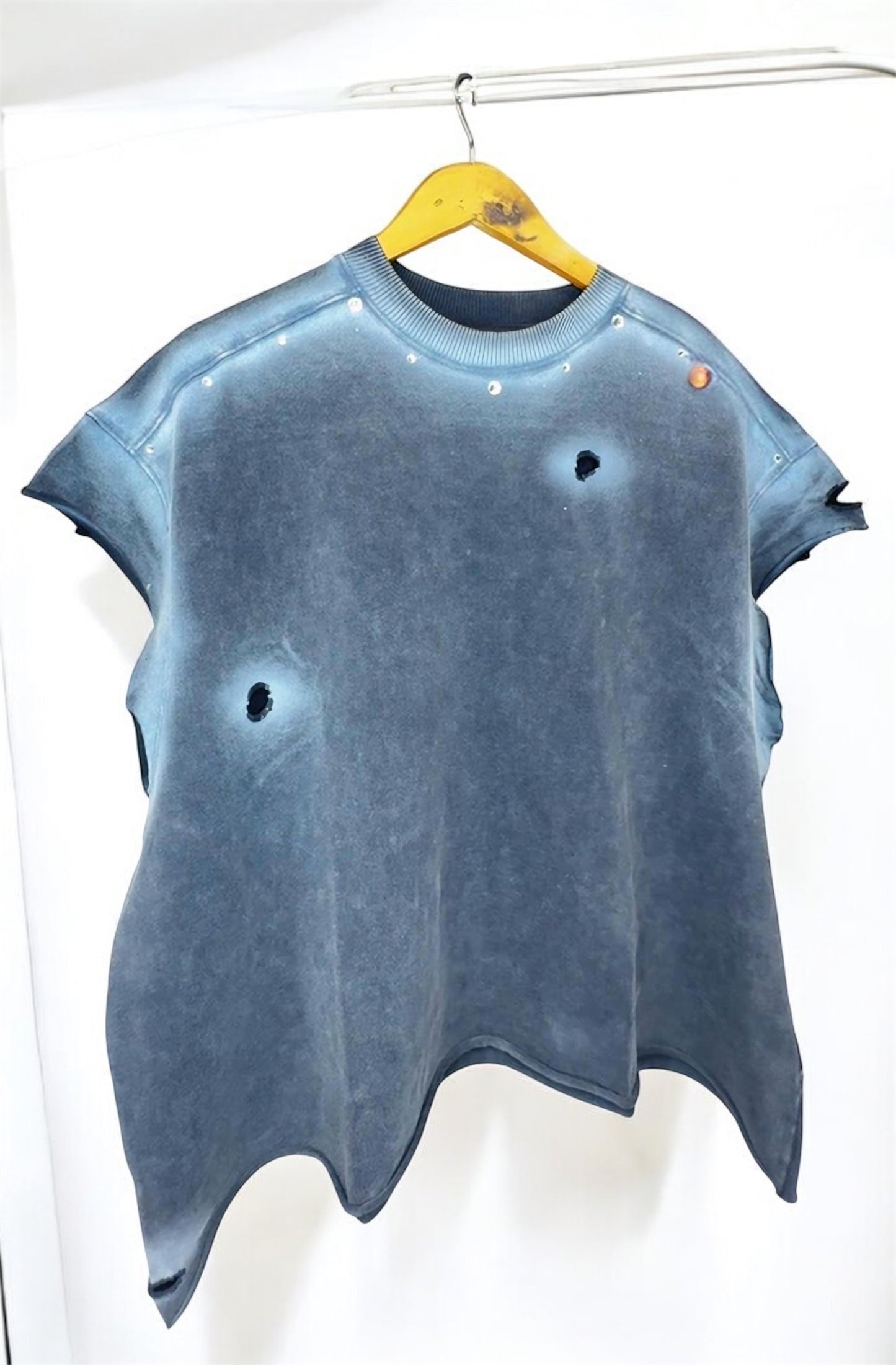 Black and white sleeveless pullover with white designs and rhinestones