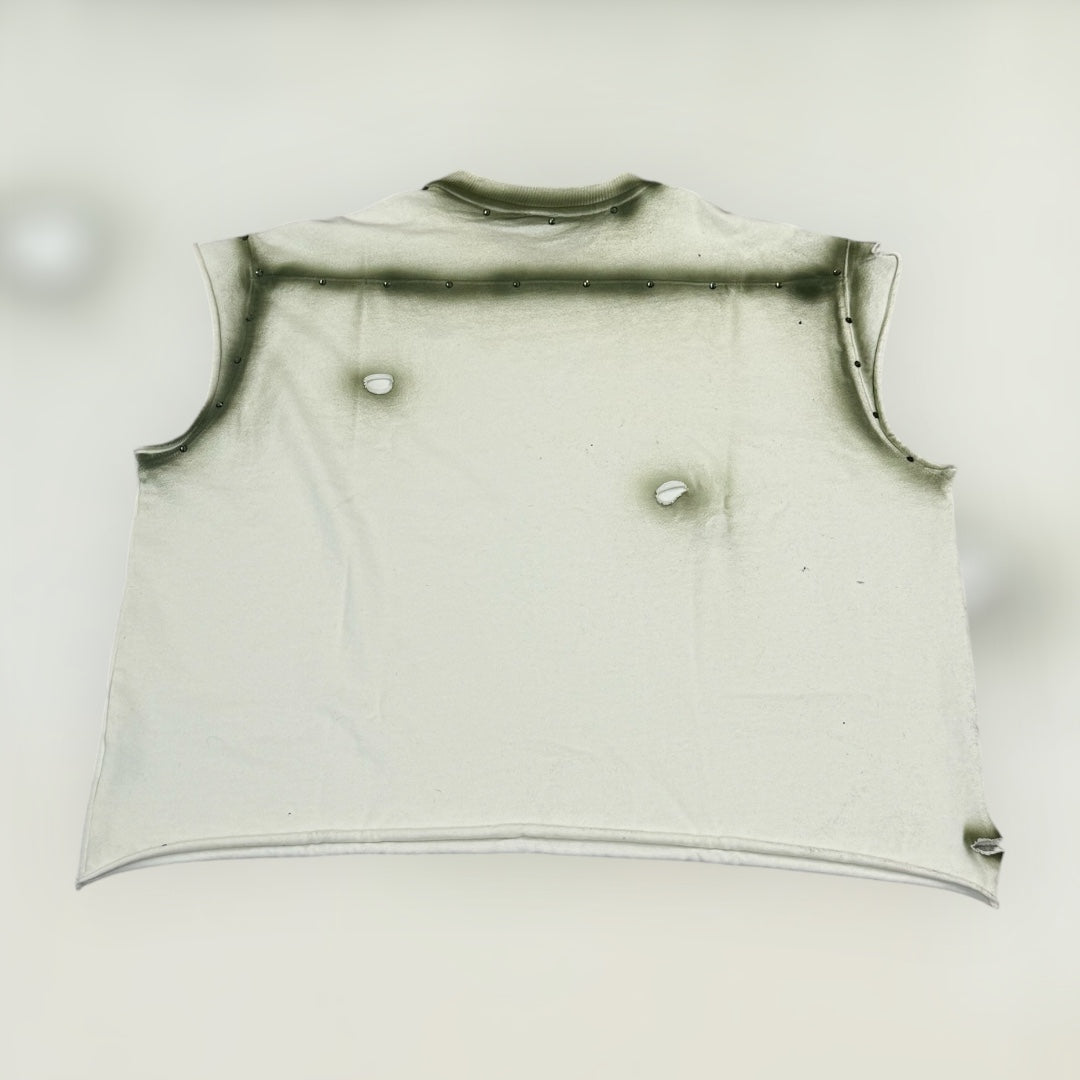 beige sleeveless with a ripped and beaded design