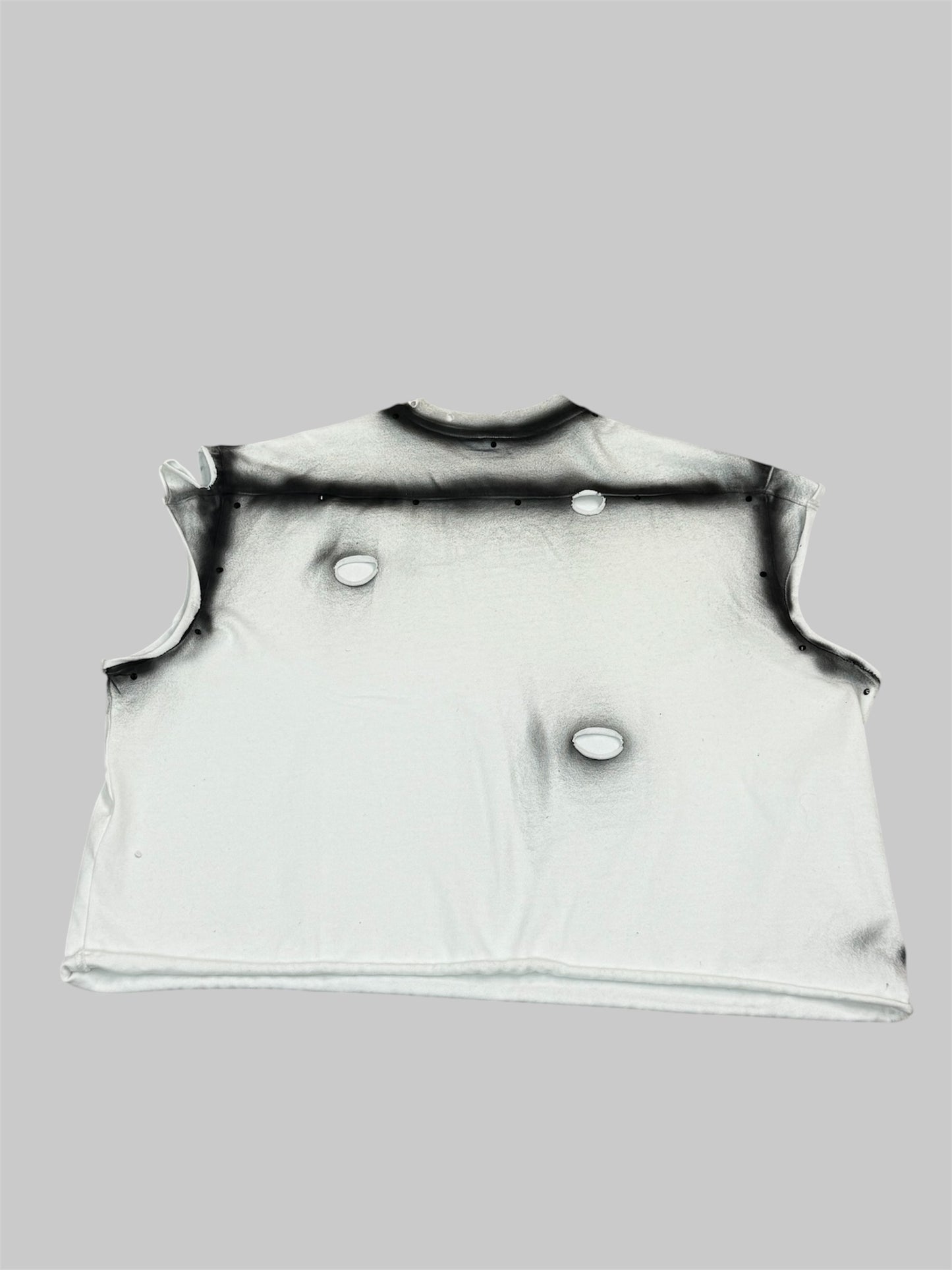 Black and white sleeveless pullover with black rhinestones and designs