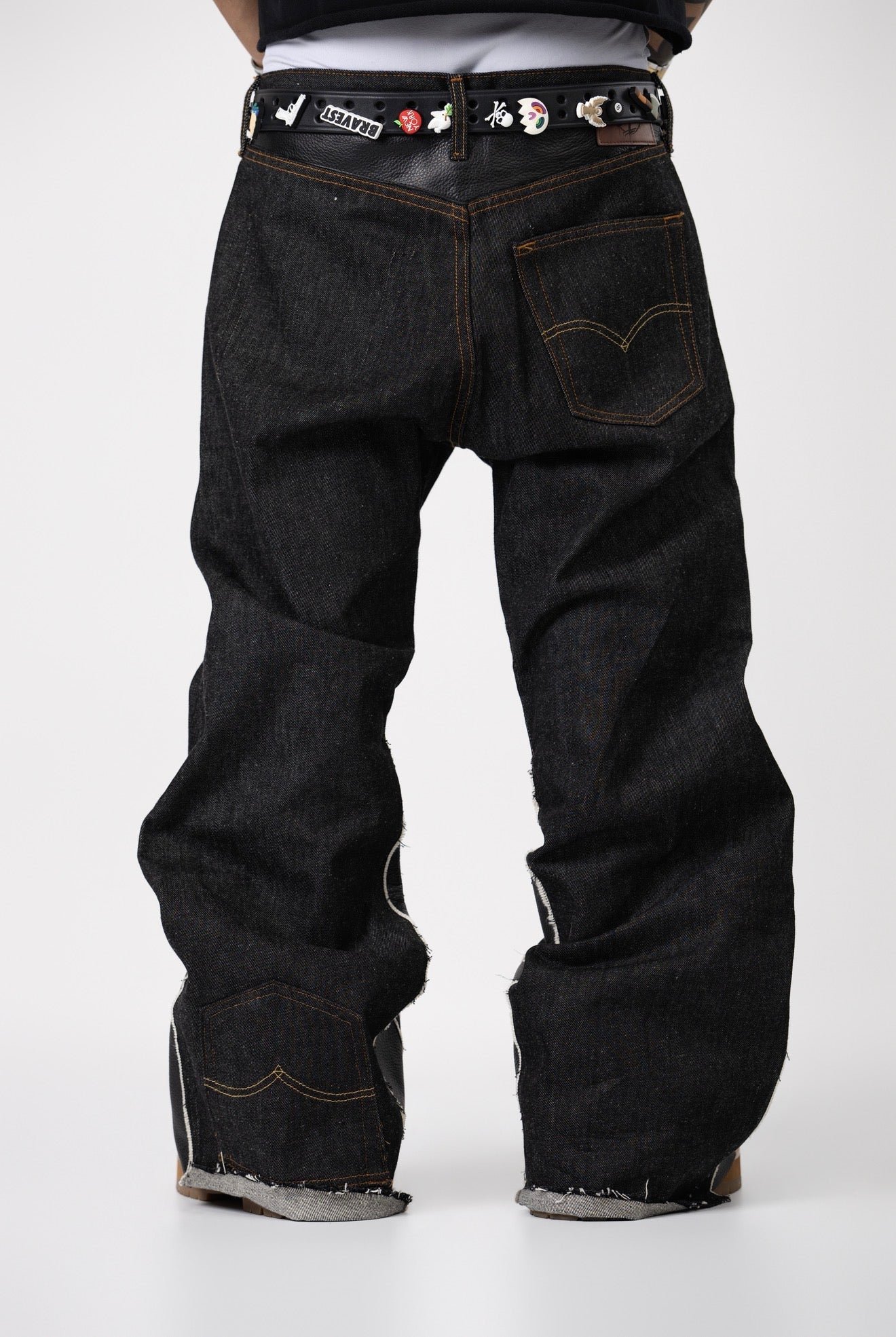 Pants with black leather designs